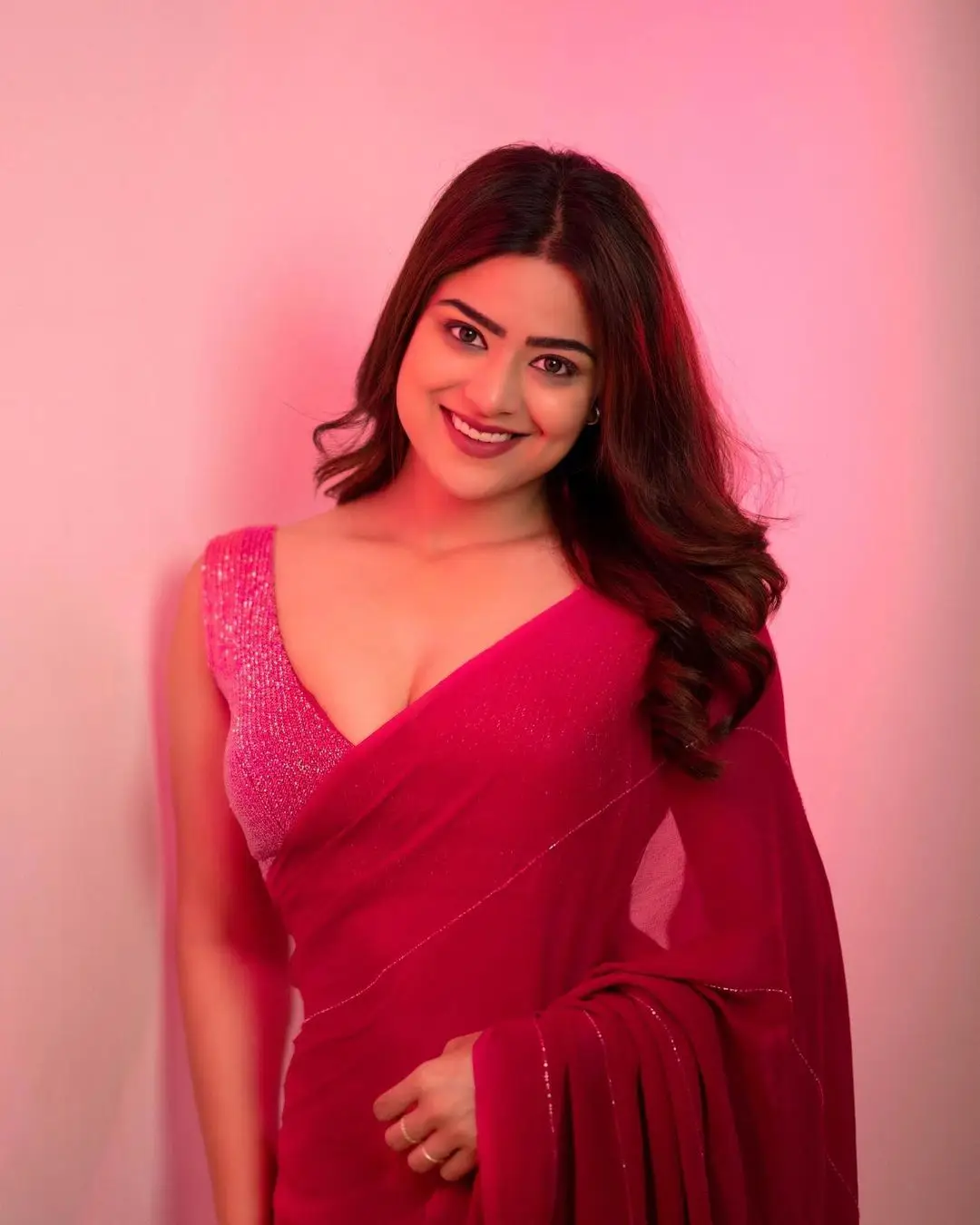 Priyanka Sharma Stills In Pink Saree Sleeveless Blouse